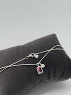 Collier mit edler Anhängerkombination - pinker Baguette Stein, Perle, Herz
